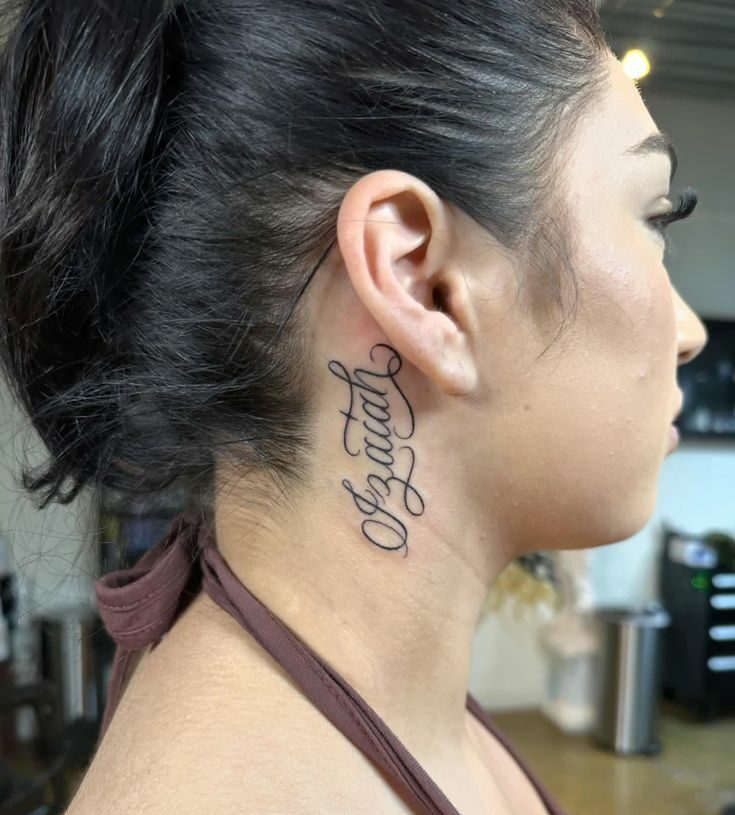 name tattoos behind ear