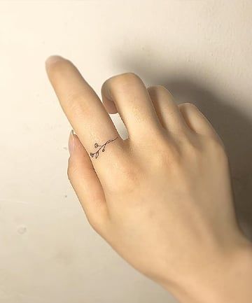 minimalistic finger tattoo