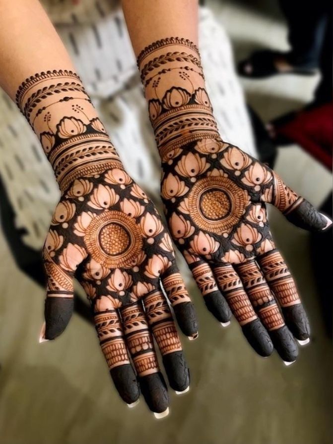 Negative mehndi design with central motif