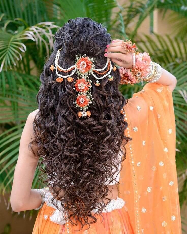 Ornamental open hair Indian bridal hairstyle