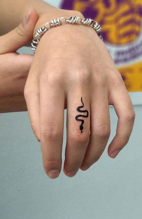 serpent finger tattoo