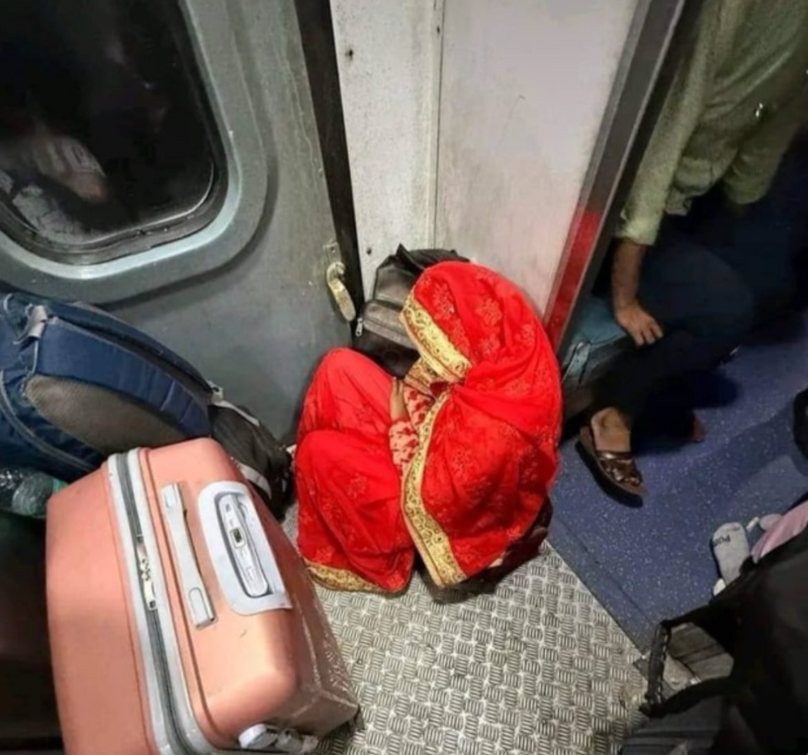 Woman sitting near toilet on train
