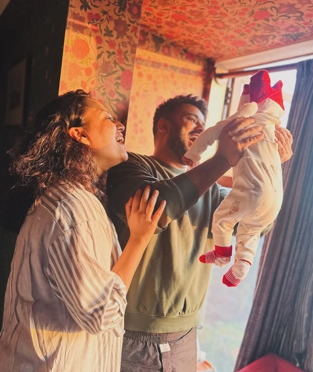 Swara with her husband and daughter