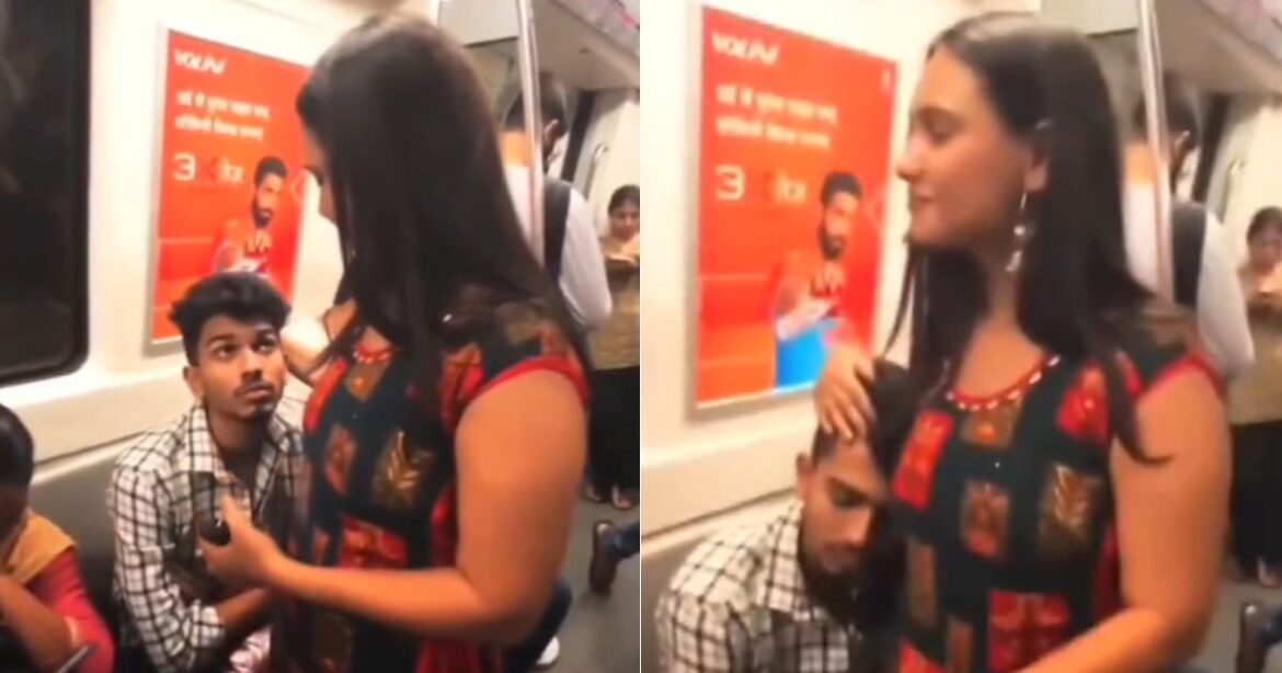 girl-supports-sleeping-man-in-delhi-metro