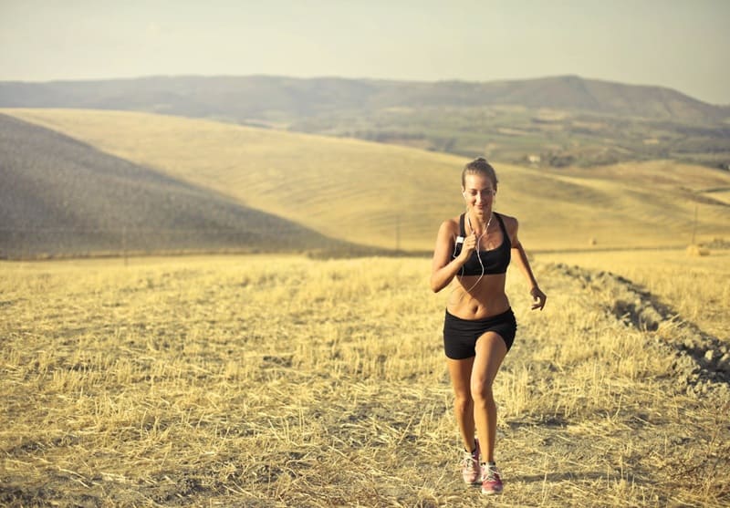 Woman running in hill
